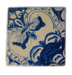 Blue and white tile fragment, one of 8 tiles (or fragments of tile) in this pattern, not listed in the Museum's earliest inventories of 1837.     