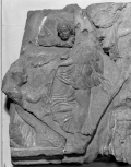 Fragment of a cresting plaque from the ridge of a Roman roof: the head and part of the right wing of a female figure 
