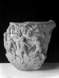 Fragment of a Roman marble vase carved with figures and foliage 