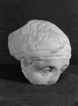 A head, a fragment of a classicizing relief