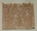 Roman roof Cresting Plaque depicting two women walking towards a stylised acanthus plant