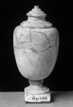 A solid marble Roman sculptured vase with lid and pedestal