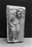 The lid of a cinerary urn: a reclining female figure 