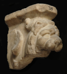 Fragment of the carved arm of a marble throne or top of a table support. 