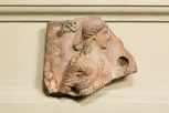 Fragment of an ancient Roman frieze slab depicting a female figure