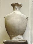 Cylindrical funerary (cinerary) urn with stylised lid and handles.