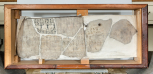 Late 19th century showcase containing eight fragments of the 18 lid of the sarcophagus of Seti I, acquired by Soane with the sarcophagus in 1824. 