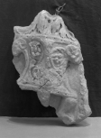 Fragment of a relief depicting the base of a candelabrum