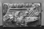 Fragmentary left end of a decorative relief panel