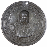 A medallion with bust and inscription 