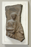 Fragment of a Roman cresting plaque depicting captive women in a mulecart in a triumphal procession