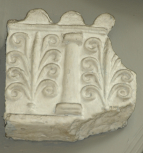 Fragment of an antique terracotta frieze with alternating columns and palmettes 
