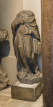 A cast of a headless draped female figure holding a book, perhaps a French late 16th century allegorical scupture