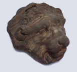 Fragment of a sarcophagus front: head of a lion 