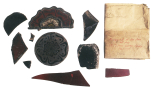Fragments of ruby glass including badges of a Red (Lancaster) Rose and a fragment of a Tudor Rose